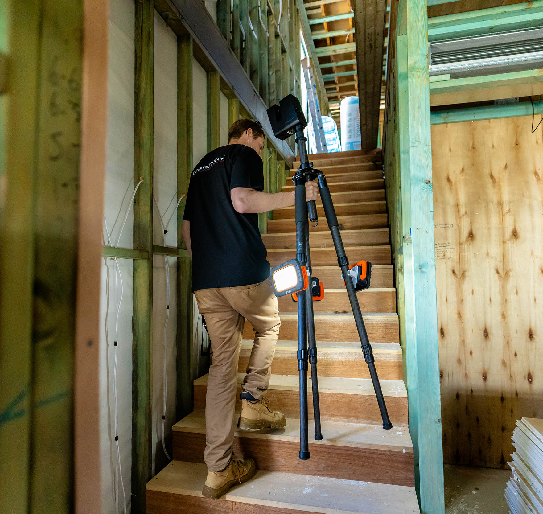 Construct Scans technician capturing a LiDAR scan on a timber-framed staircase